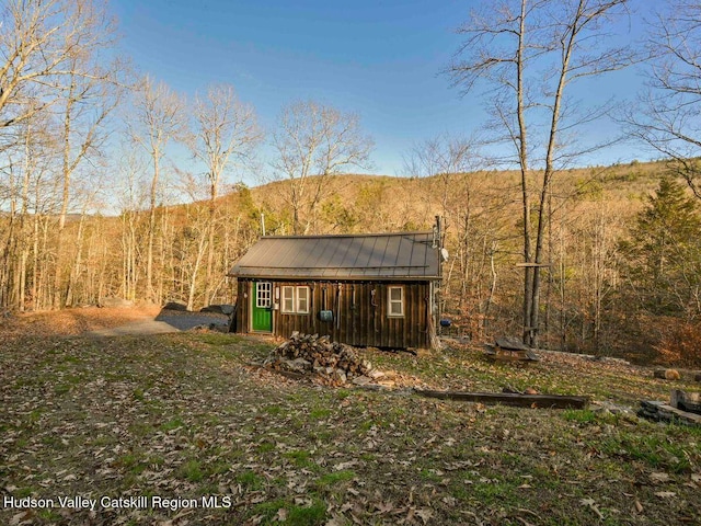 exterior space featuring an outbuilding