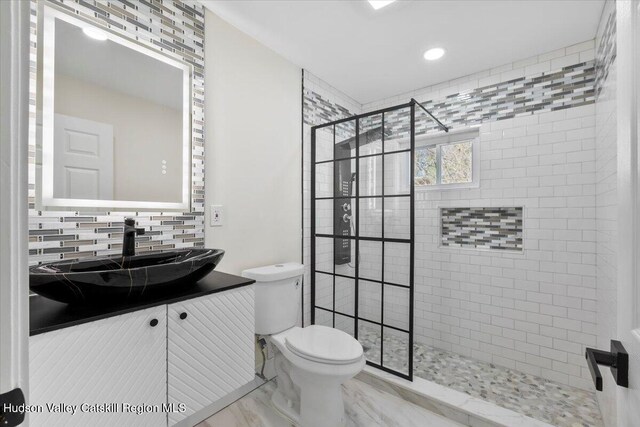 603-607 Old Stage Rd, Saugerties, NY 12477 - full bathroom with a stall shower, toilet, decorative backsplash, vanity, and marble look tile flooring