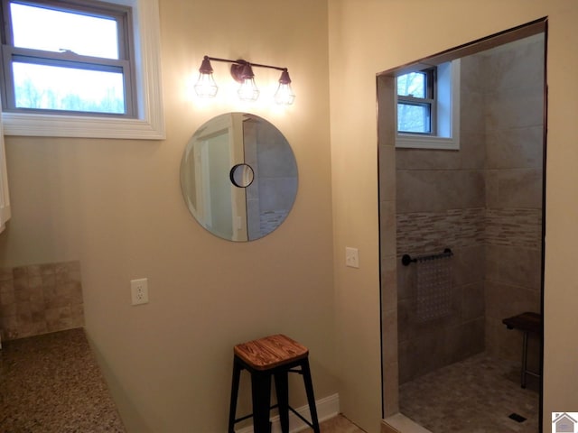 bathroom featuring a tile shower