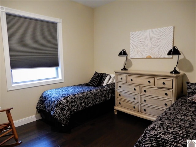 bedroom featuring dark wood-type flooring