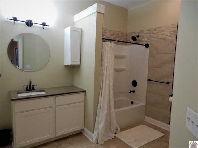 bathroom with tile flooring, shower / bath combination with curtain, and vanity