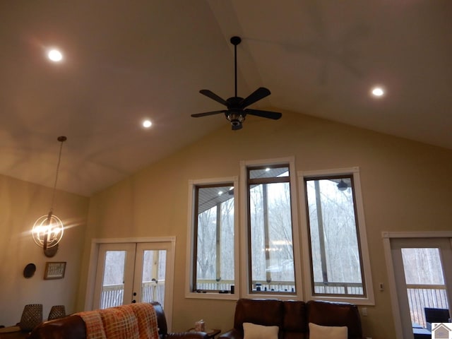 interior space with french doors and ceiling fan with notable chandelier