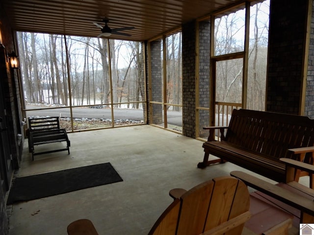 sunroom with ceiling fan and a wealth of natural light