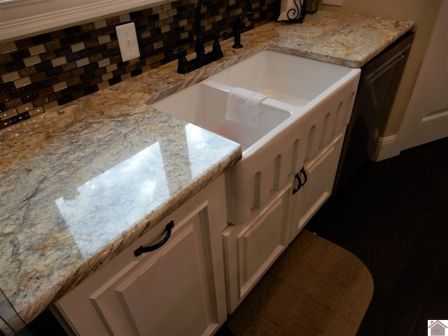 interior space with tasteful backsplash and sink