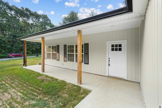 doorway to property with a yard