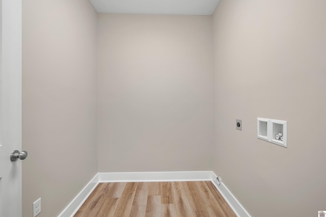 washroom featuring electric dryer hookup, hookup for a washing machine, and light wood-type flooring