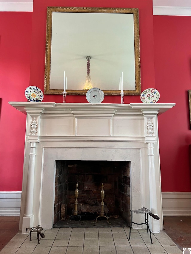 interior details featuring light wood-type flooring and crown molding