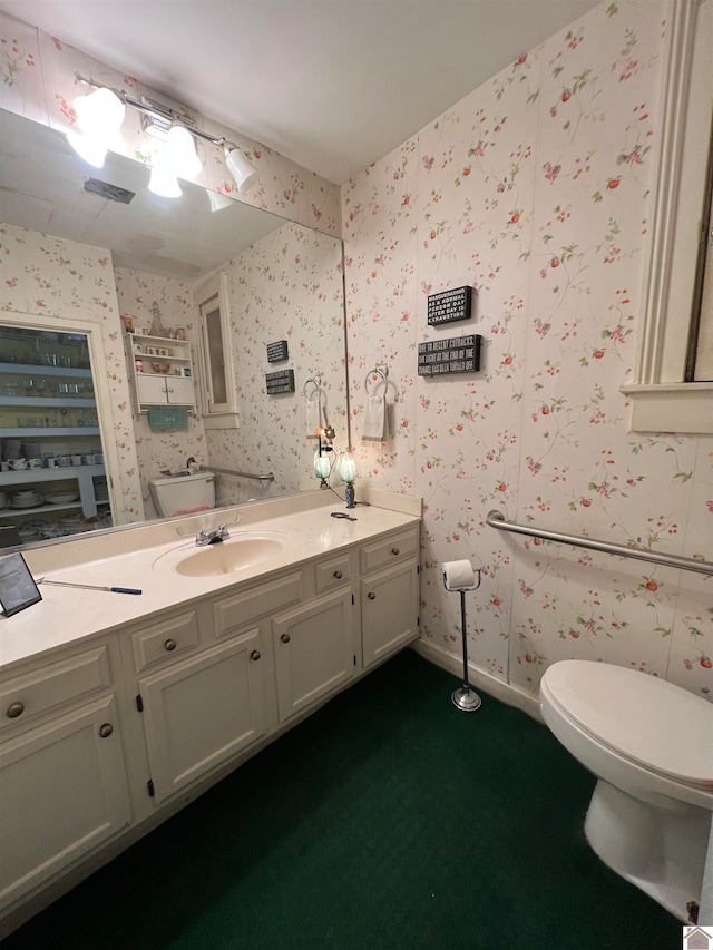 bathroom with toilet and vanity