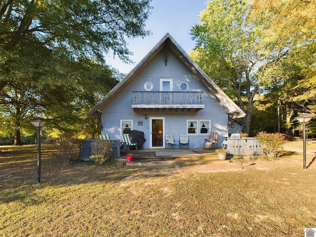 rear view of property featuring french doors and a yard