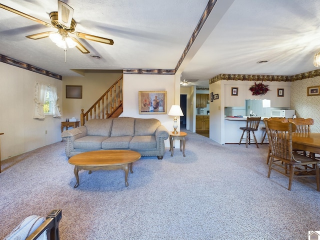 carpeted living room featuring ceiling fan