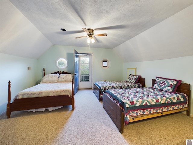 carpeted bedroom featuring vaulted ceiling, a textured ceiling, access to exterior, and ceiling fan