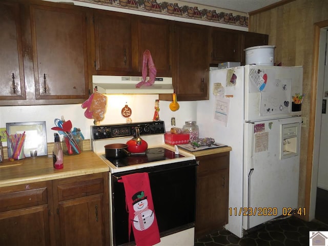 kitchen with white appliances and dark brown cabinetry