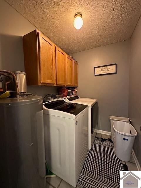 laundry area with independent washer and dryer, a textured ceiling, cabinets, and water heater