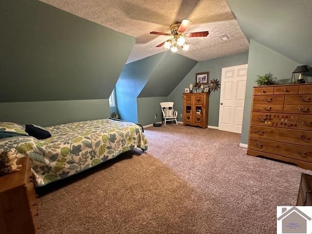 bedroom with dark carpet, vaulted ceiling, ceiling fan, and a textured ceiling