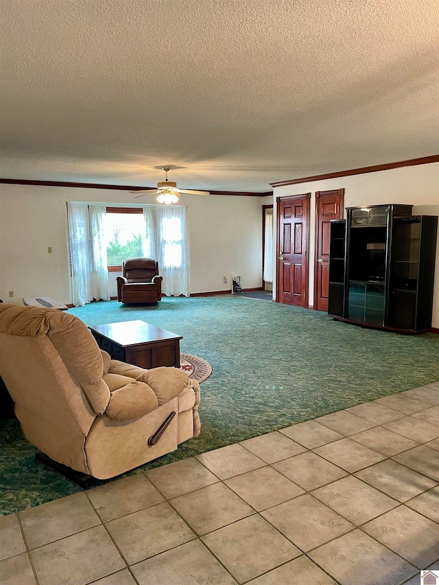 living room featuring light carpet, a textured ceiling, ceiling fan, and ornamental molding