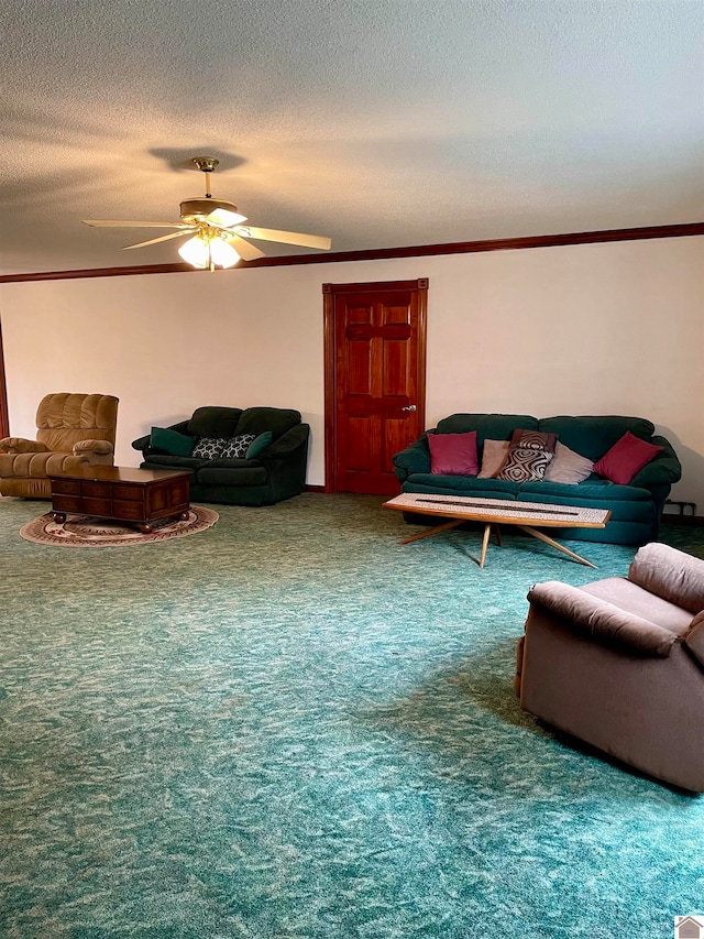 living room with ceiling fan, carpet flooring, and a textured ceiling