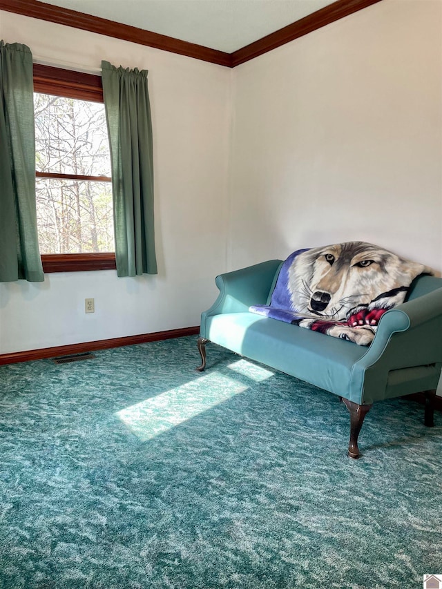 living area featuring ornamental molding and dark colored carpet