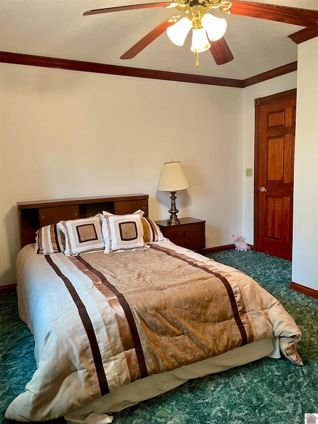 bedroom with ceiling fan, dark colored carpet, a textured ceiling, and crown molding