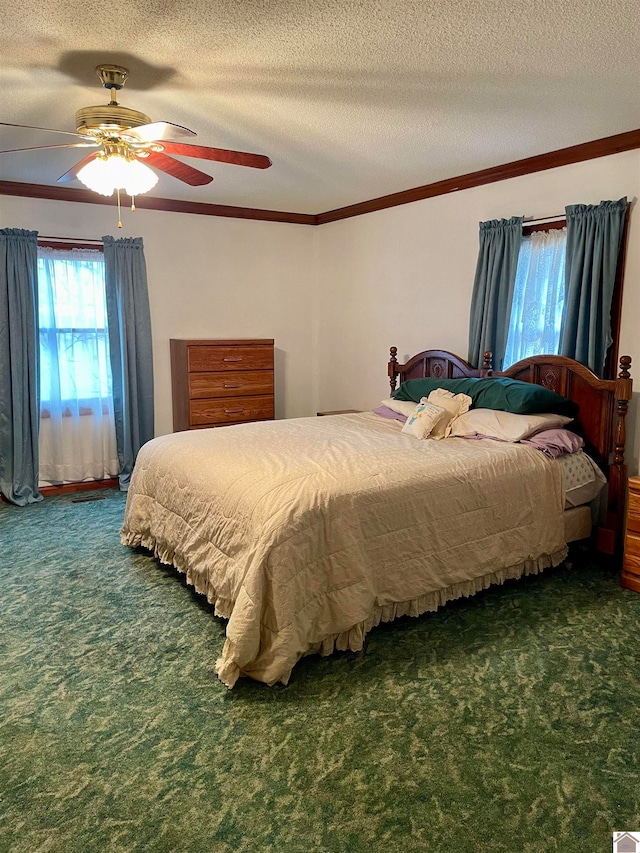 carpeted bedroom featuring a textured ceiling and ceiling fan