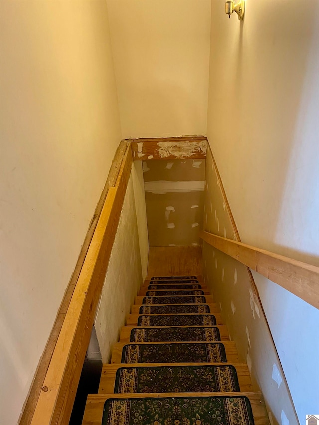 stairway with light tile floors