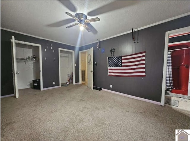 unfurnished bedroom with ceiling fan, a textured ceiling, and light carpet