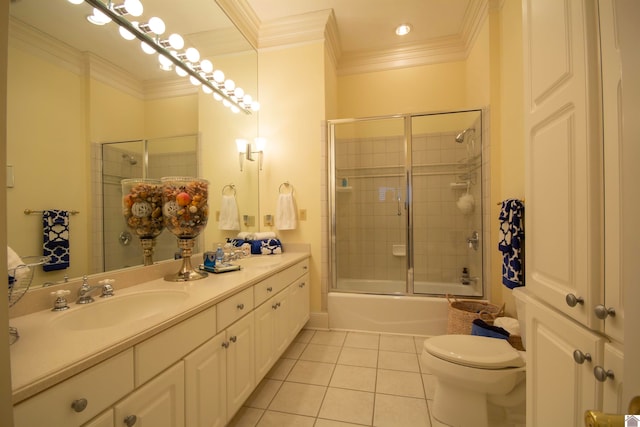 full bathroom featuring vanity, combined bath / shower with glass door, tile floors, toilet, and crown molding