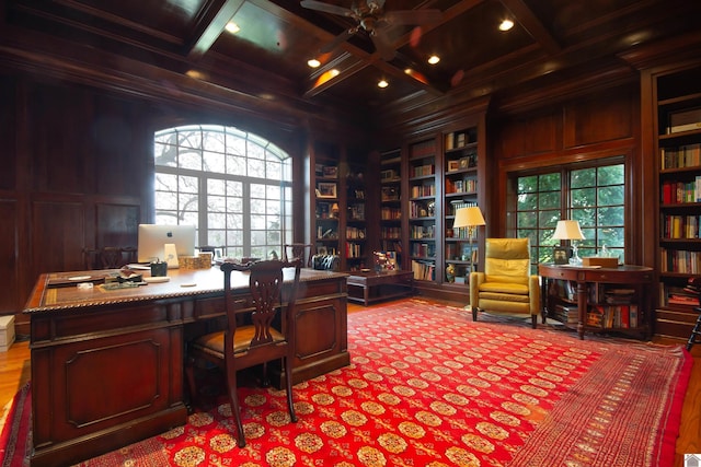 office space featuring coffered ceiling, hardwood / wood-style flooring, and beamed ceiling