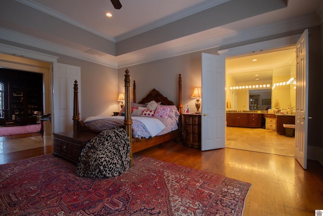 bedroom featuring dark hardwood / wood-style flooring, ceiling fan, and ornamental molding