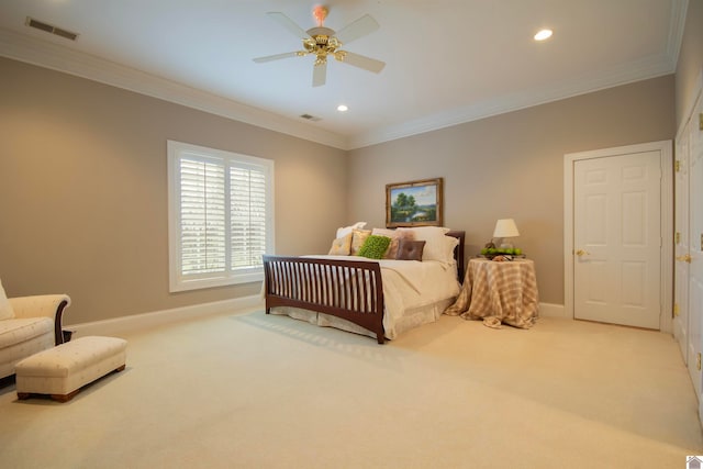 bedroom with ceiling fan, crown molding, and carpet