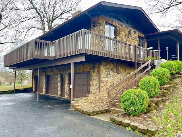 view of front facade with a balcony and a garage