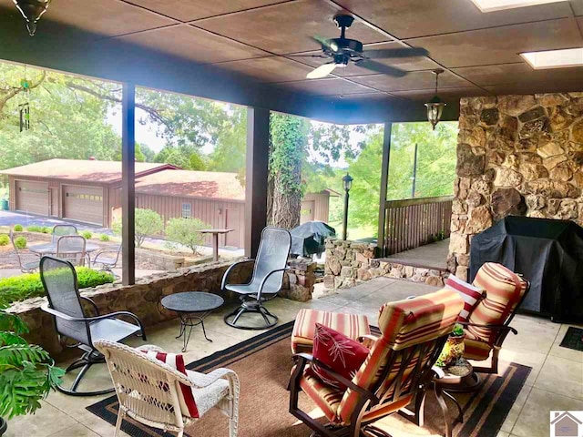 sunroom / solarium with ceiling fan