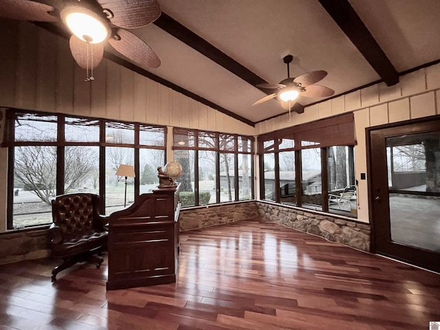 unfurnished sunroom featuring ceiling fan and lofted ceiling with beams