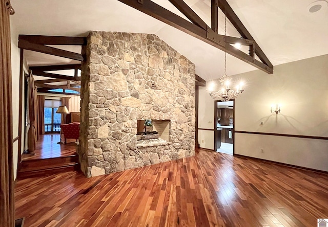 unfurnished living room with dark wood-type flooring, high vaulted ceiling, a notable chandelier, a fireplace, and beam ceiling