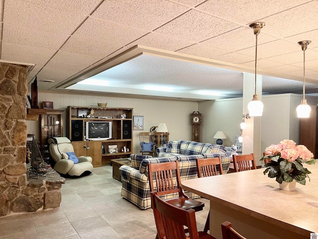 interior space with hanging light fixtures and light tile floors