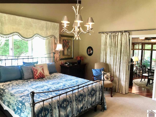 carpeted bedroom with a chandelier and multiple windows