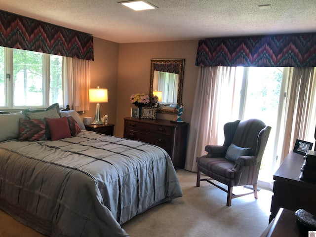 carpeted bedroom with a textured ceiling