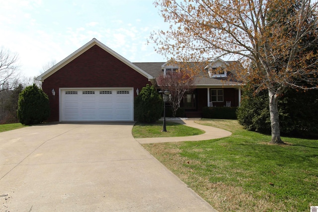 view of front of home with a front yard and a garage