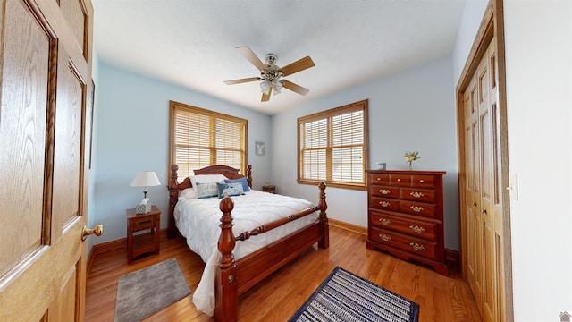 bedroom featuring a closet, ceiling fan, and light wood-type flooring