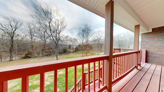 wooden deck with a yard