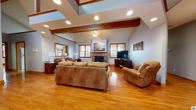 living room with beam ceiling and light hardwood / wood-style floors