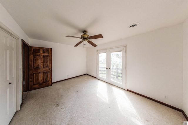 unfurnished bedroom featuring french doors, access to exterior, light colored carpet, and ceiling fan