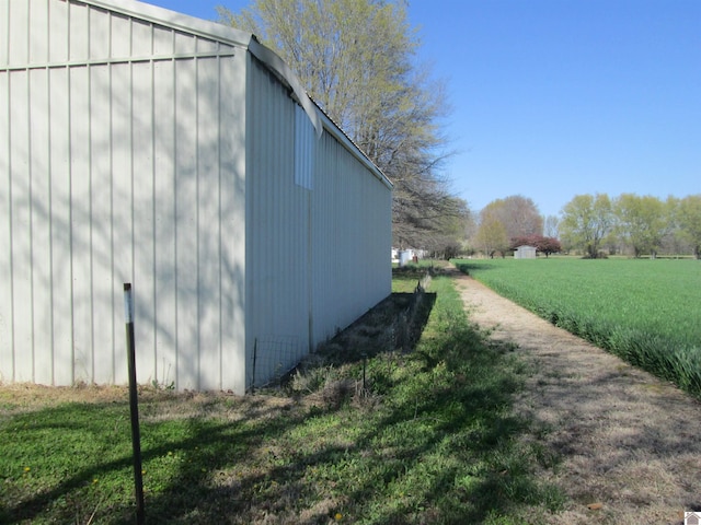 view of side of home featuring a yard