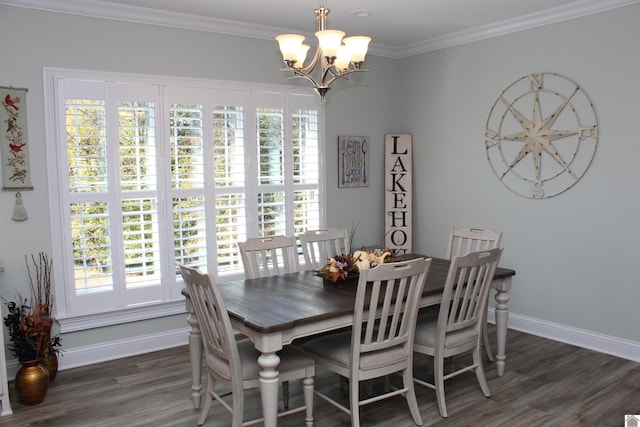 dining space featuring dark hardwood / wood-style flooring, a notable chandelier, ornamental molding, and plenty of natural light