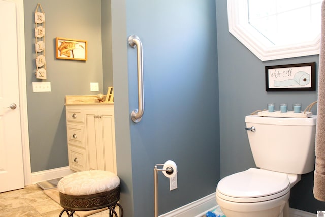 bathroom with vanity, tile flooring, crown molding, and toilet