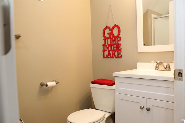 bathroom with toilet and vanity