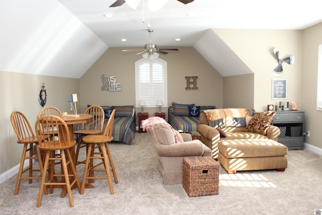 carpeted living room featuring lofted ceiling and ceiling fan