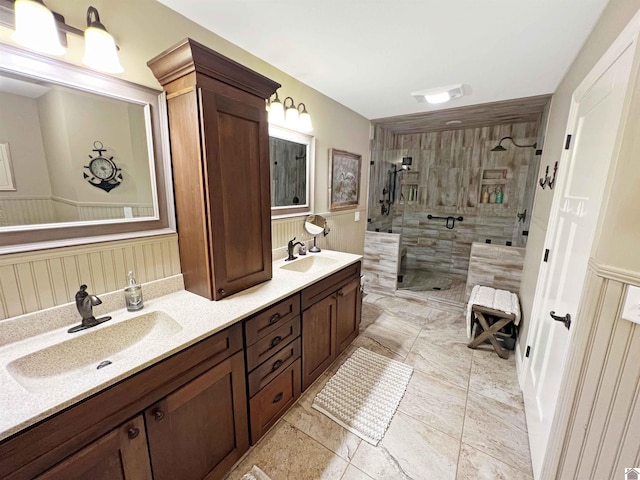 bathroom featuring tile flooring, double vanity, and a shower with shower door