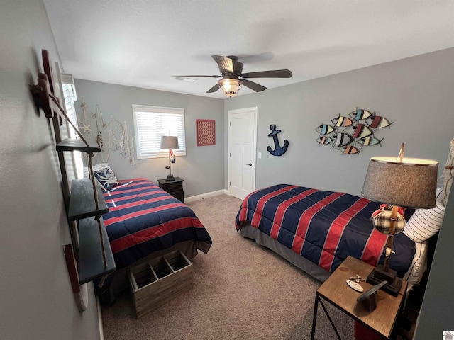 carpeted bedroom featuring ceiling fan