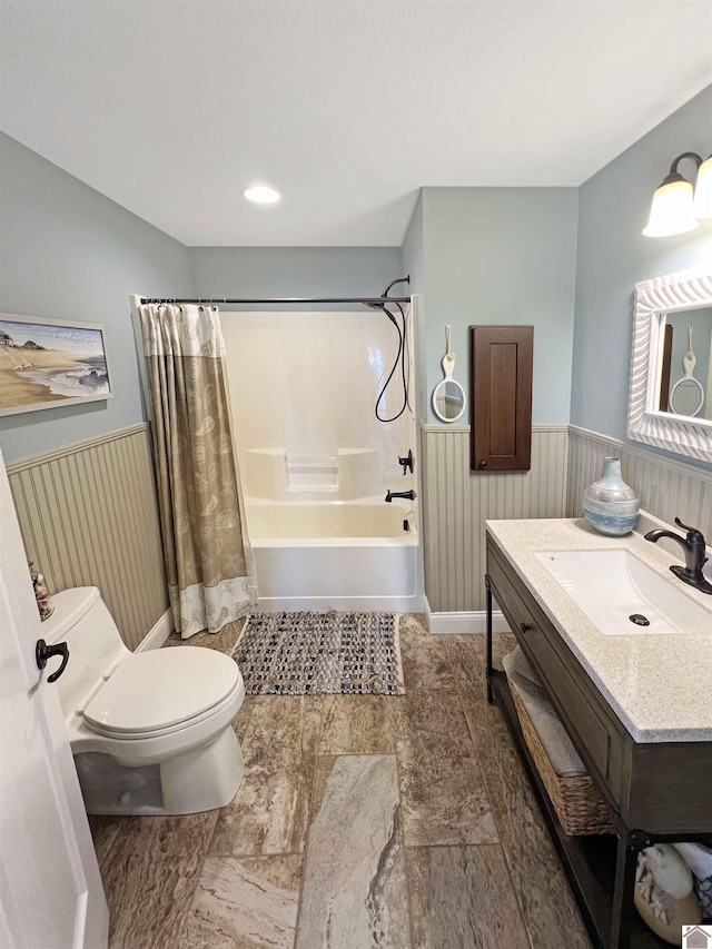 full bathroom with tile flooring, toilet, vanity, and shower / tub combo with curtain