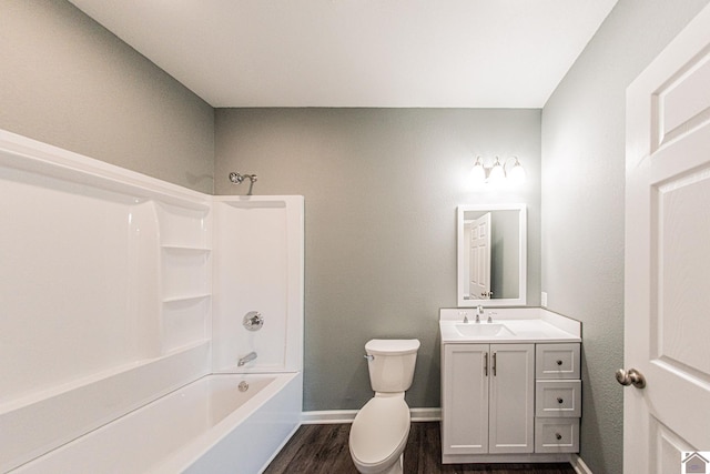 full bathroom with oversized vanity, hardwood / wood-style flooring, tub / shower combination, and toilet